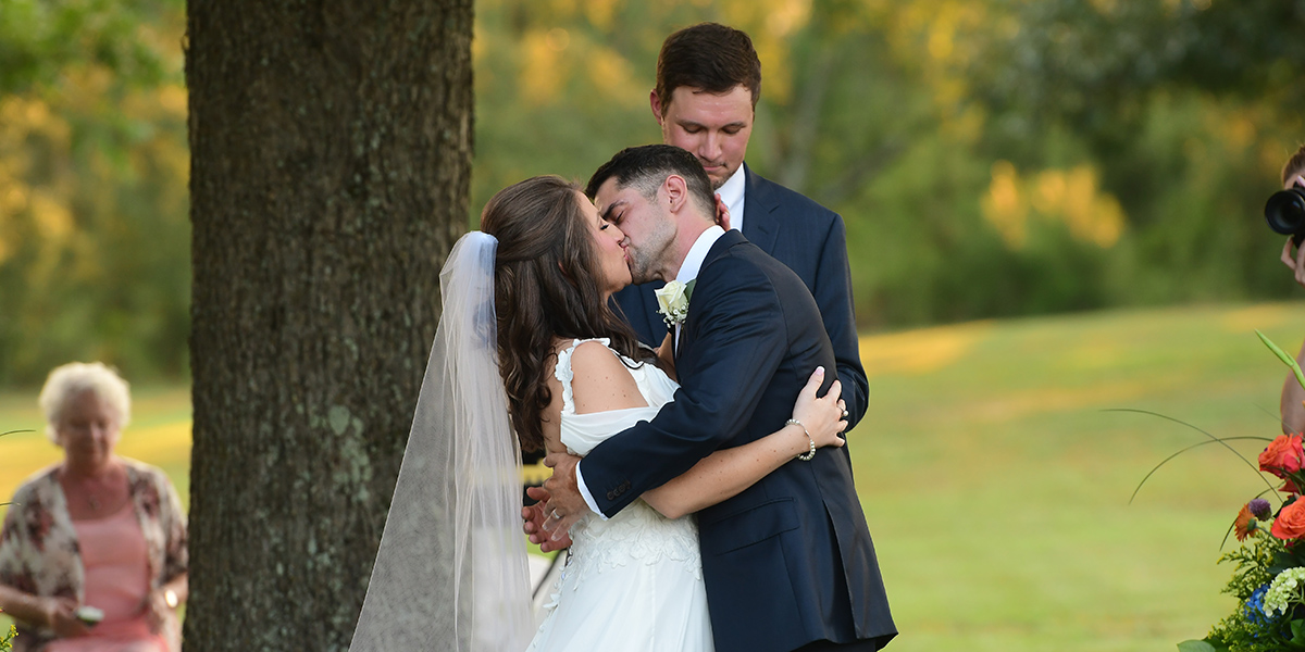 Couple shares first kiss at wedding ceremony