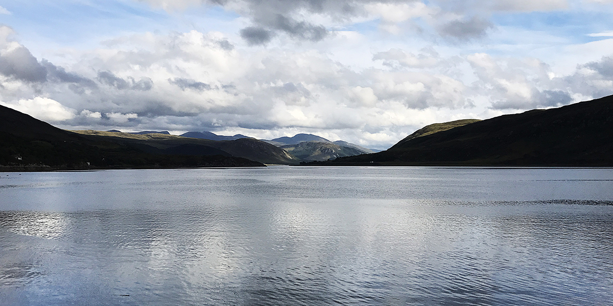 Lake surrounded by mountains in Scotland